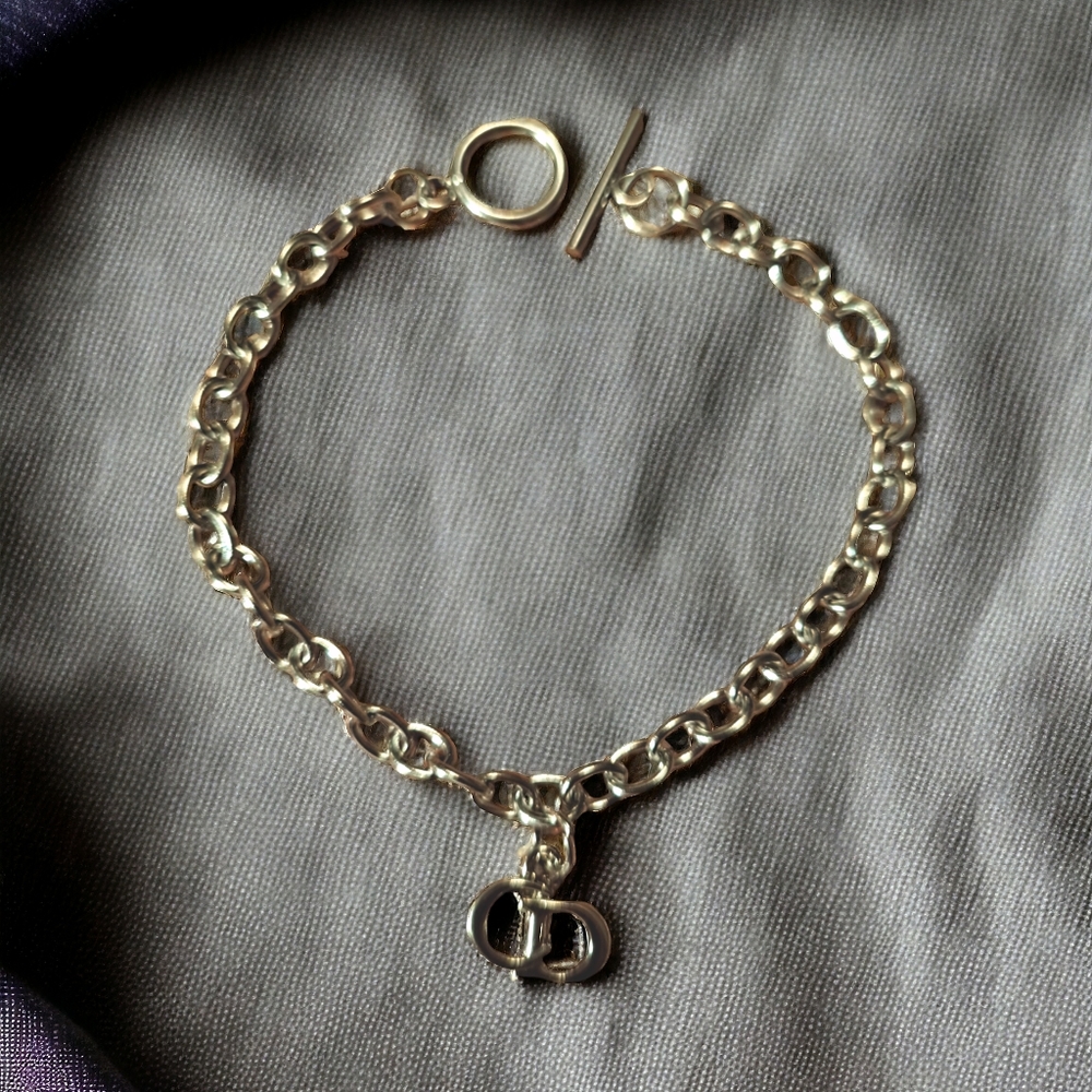 Charm  on a stainless steel bracelet with toggle clasp